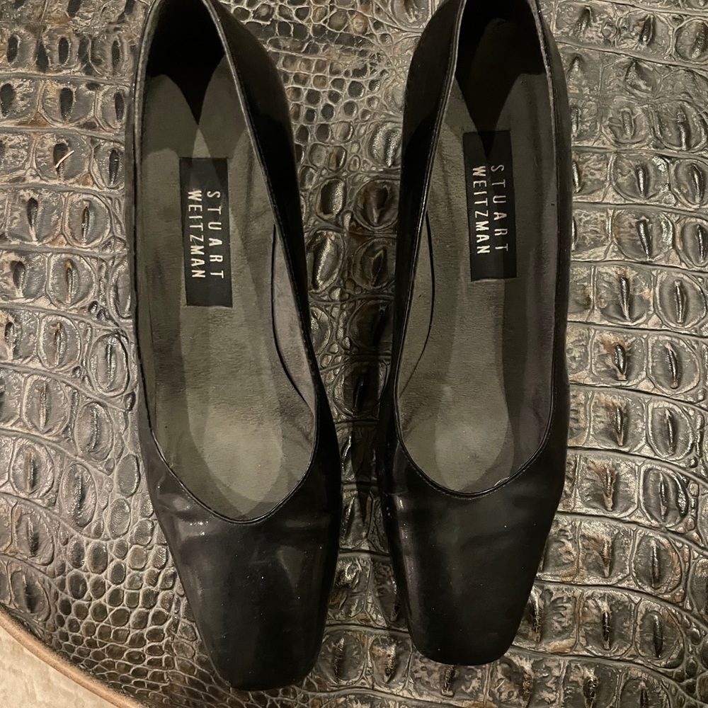 Used Stuart Weitzman black patent pumps. Size 8